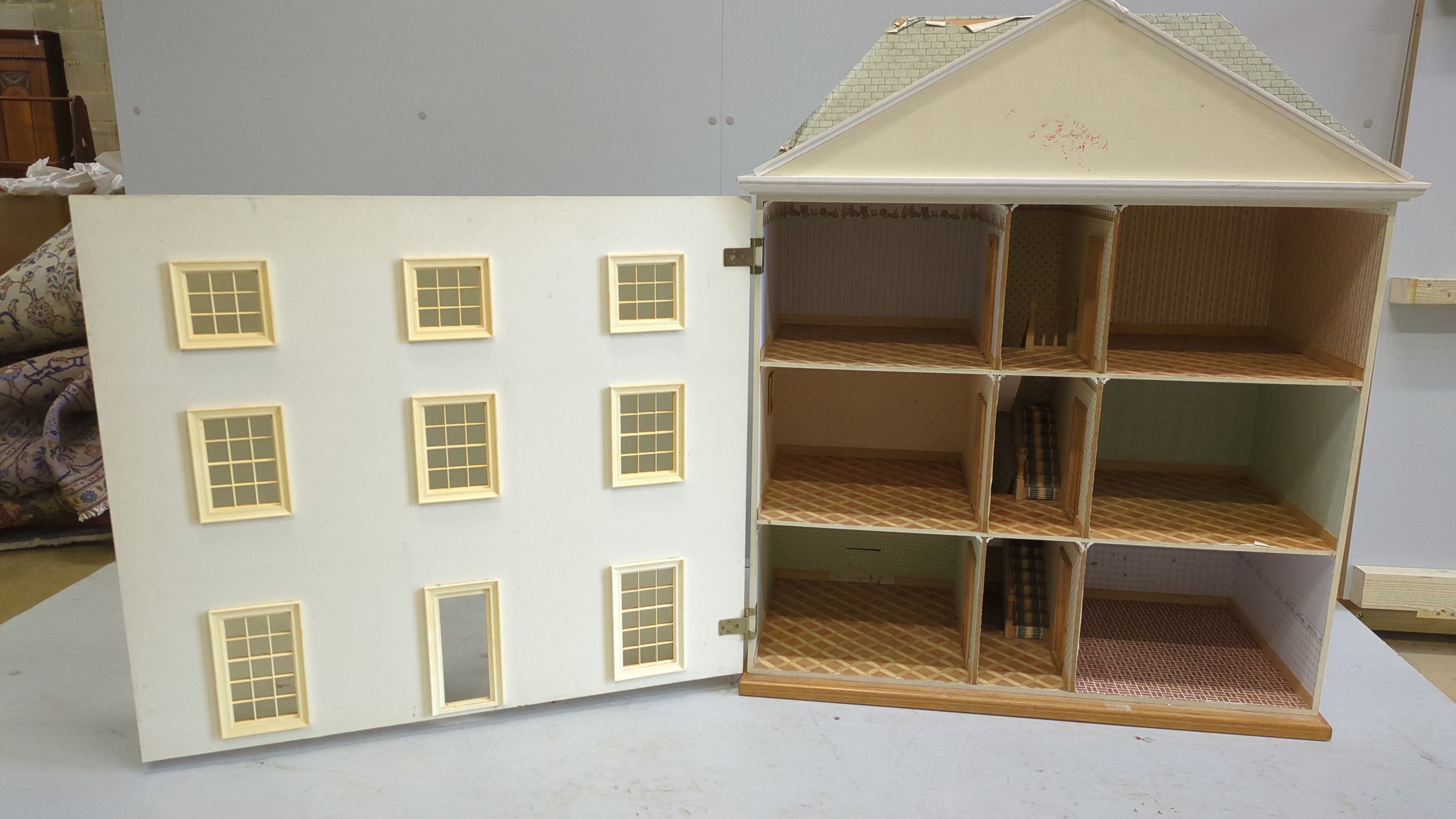 A modern Georgian style dolls house and accessories, the house is divided into six rooms on three floors, together with a collection of furniture and accessories, house dimensions; 103cm high, 90cm wide and 44cm deep